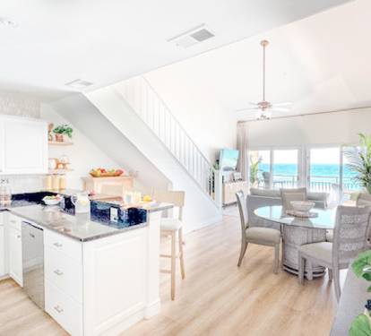kitchen with tiled backsplash, stainless appliances, solid surface counters!