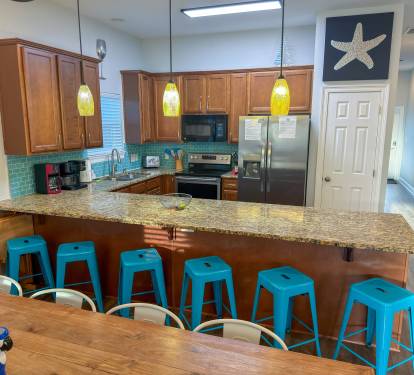 Additional breakfast bar seating for six makes hosting easy while keeping everyone connected.