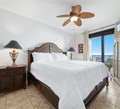 Main bedroom with king size bed and direct balcony access