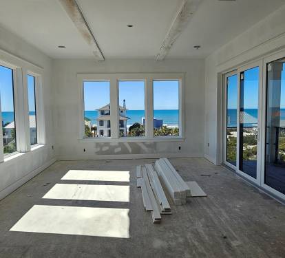 Dining Room with 180 degree gulf water views, dining table seating 14. 6-7 additional seating at the breakfast table and seating 7 at the kitchen island. All within an open concept room for dining together in 1 space.