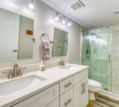 Step into a refreshing walk-in shower.