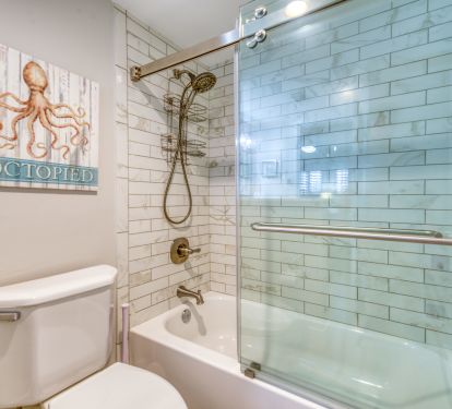 A spacious tub and shower for your comfort.