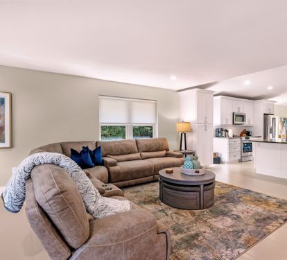 Living room open to the kitchen and dining