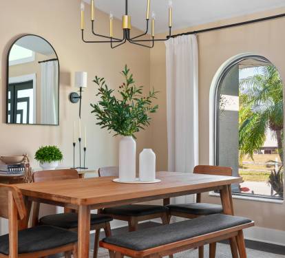 Experience memorable meals in this elegant dining area. Bathed in natural light, this inviting space boasts stylish decor and a warm, welcoming ambiance.