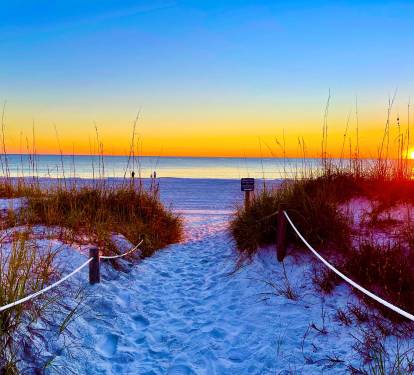 Beautiful sunsets and soft white cool sugar sand.