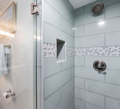 ?? "Style and Comfort Combined. The guest bath features a sleek walk-in tile shower, modern sink, and convenient seating—designed to make every moment at After Dune Delight feel luxurious." ?