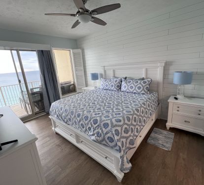 Master Bedroom-King Bed 55" TV with Gulf view and balcony access shiplap wall