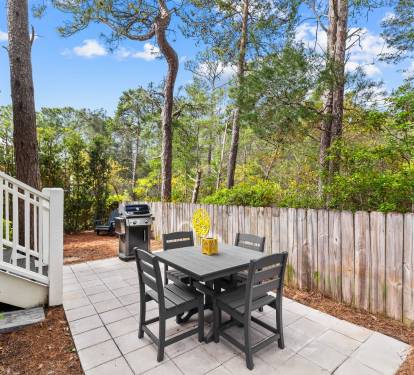 A new patio, table set, and grill are the perfect place for a relaxed dinner.