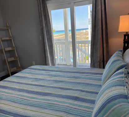 King Bedroom on Main level-Gulf Views. Great views of gulf and access to deck.