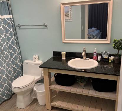 Clean and spacious master bathroom with a large vanity and modern fixtures.