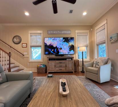 85 inch 4K UHD TV in Living Room; Bose soundbar. 