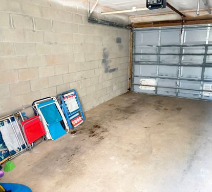 Private Garage w/ Beach Chairs, toys and entry to Condo
