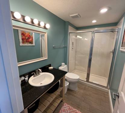 Comfortable guest bedroom designed for a restful night's sleep after a day at the beach.