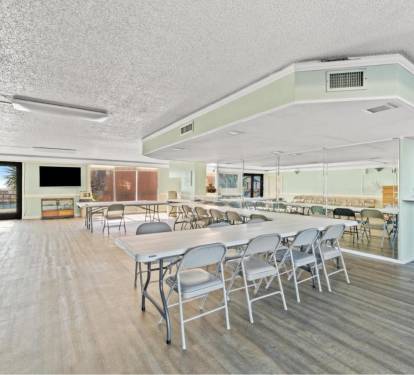 Common area/social room overlooking the pools and Gulf