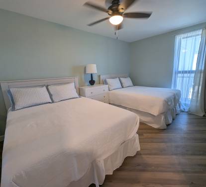 Dual queen beds taken from the doorway