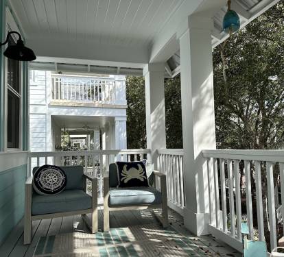 Master bedroom porch offers privacy, comfort & great tree top views of courtyard