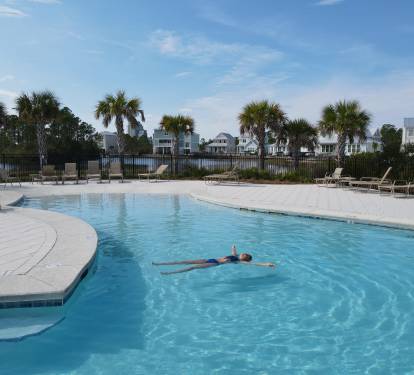 Enjoy the resort-style zero-entry swimming pool on a hot summer day, or relax with your favorite book in one of the many lounge seats.  Have your lunch in the covered area nearby.  All without the crowds of a high-rise condo.