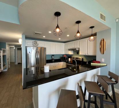 Fully equipped kitchen with modern appliances—perfect for whipping up a beachside breakfast.