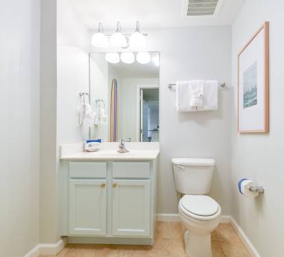 Clean bathroom w/ sink, storage, and fresh towels for everyday comfort.
