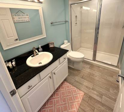 Convenient second full bath, pristine and fully stocked with fresh linens.