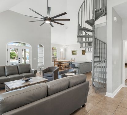 Open living area with comfortable seating and Gulf-inspired artwork