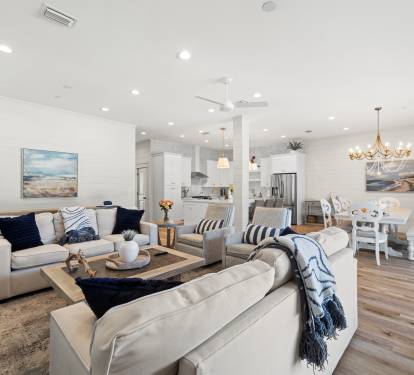 Living room is just off of the kitchen and dining room and overlooks the pool deck