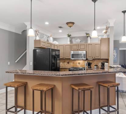 Kitchen with bar stools for additional seating