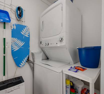 Laundry room with stacked washer/dryer