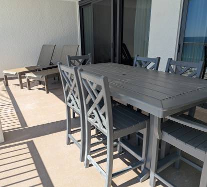 Patio is oversized with brand new coatings, exterior paint, and railings.
