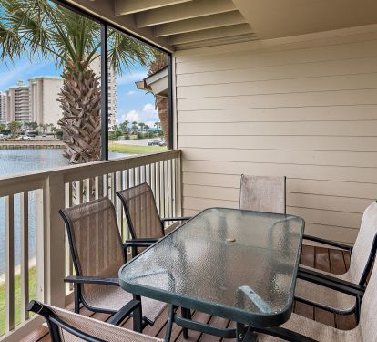 Outside dining on screened-in deck off living area