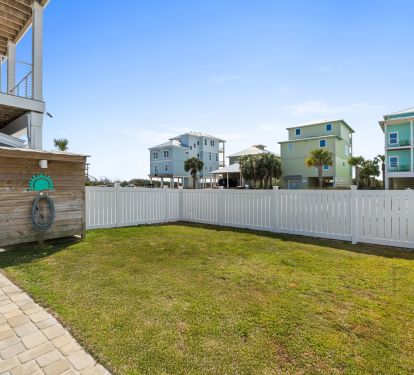 Fenced in yard with green space 