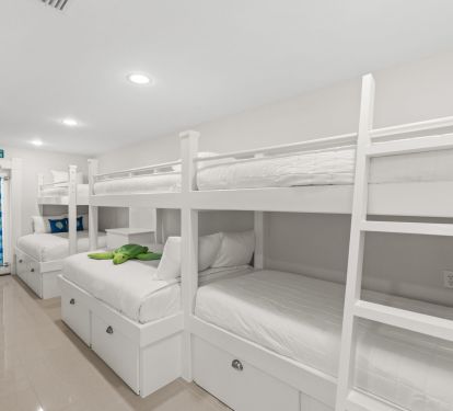 Large bunk room with two double beds, 4 twins en suite bath 