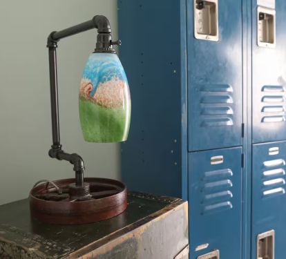 One-of-a-kind lamp made by the owner. The trunk was found in a Ala antique shop.