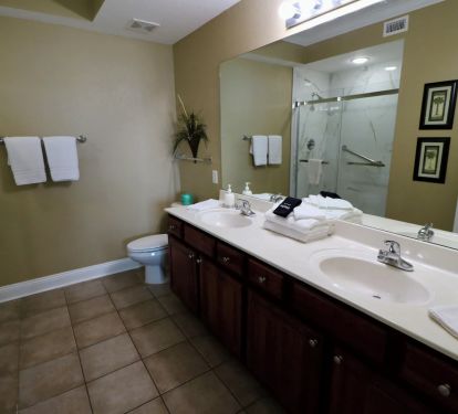 Master Bathroom with walk in shower and 2 sinks.