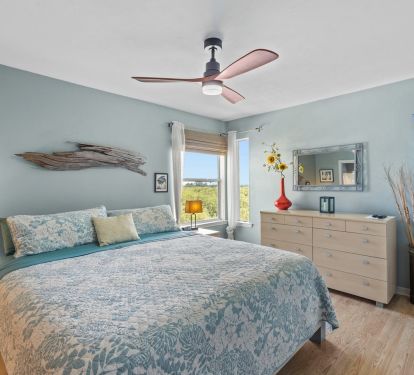 King Bedroom with ensuite bath, walk in closet, television.