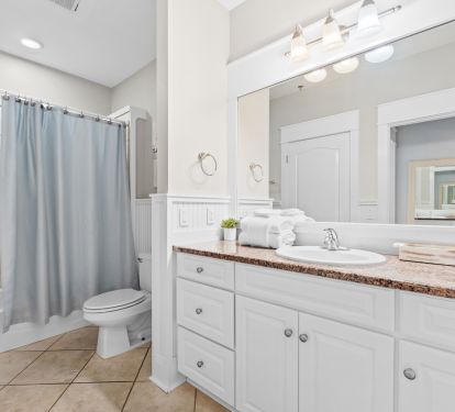 Spacious full bath with double vanity and modern finishes. Plenty of room for families to get ready with ease, stocked with fresh towels and thoughtful touches to make your stay stress-free.