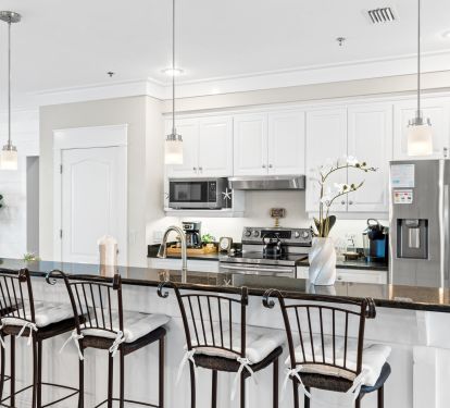 Cook like a pro in the fully equipped gourmet kitchen with stainless appliances, granite counters, and breakfast bar seating. Perfect for big meals, quick snacks, or enjoying coffee with Gulf views.
