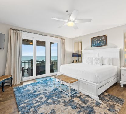The second master king bedroom with private balcony access and sweeping Gulf views. Wake up to the sound of the waves and end your day with sunset skies&mdash;all from the comfort of your plush retreat.