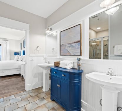 Modern bathroom with designer details, walk-in shower, and bright coastal styling. Every detail is designed for comfort and convenience during your beach getaway.