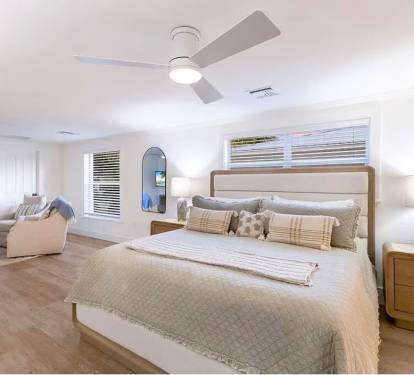 Sirenia By The Sea - Primary Bedroom on Main Floor with Sitting Area / TV