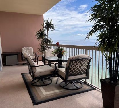 Our lovely balcony enclosed with patio furniture and 3 chairs with cushions for added comfort.