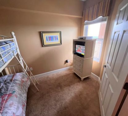 This bedroom is the perfect space for the kids to occupy, featuring a bunk bed with 2 twin beds.