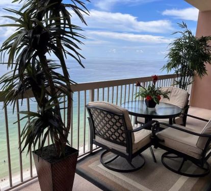 Our lovely balcony enclosed with patio furniture and 3 chairs with cushions for added comfort.