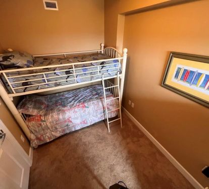 This bedroom is the perfect space for the kids to occupy, featuring a bunk bed with 2 twin beds.