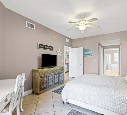 Master bedroom has tv.
