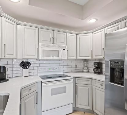 Kitchen with tiled backsplash.