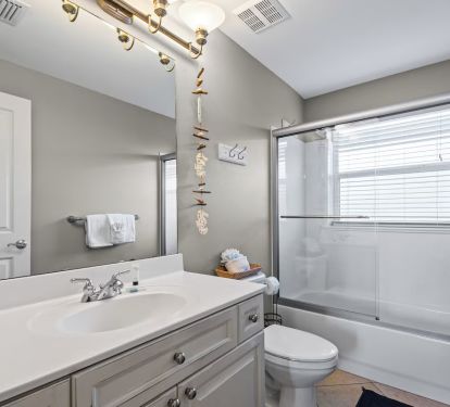 Guest bath has shower/tub combination.