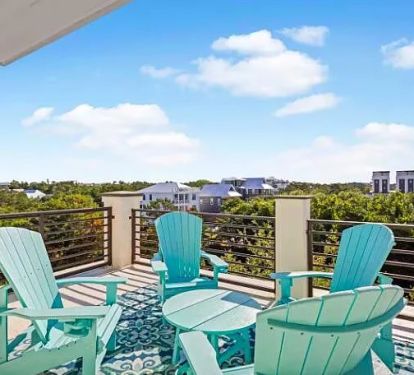 One of two private rooftop patios accessible from an interior staircase, with views of 30a and the emerald waters.