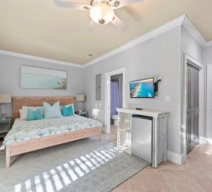 Ground floor suite with bathroom and siting area. Beverage fridges in bedrooms