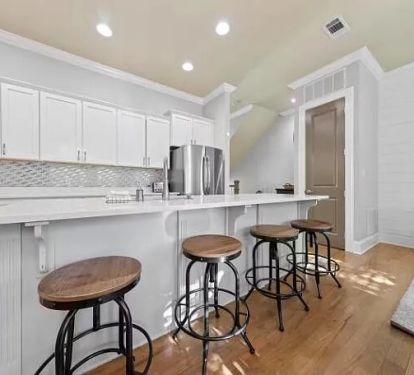Enough cooking space for everyone, plus a breakfast counter.